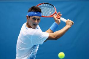 Tomic sails through round one