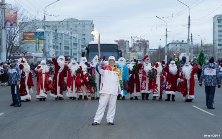 Torch meets a few Santas