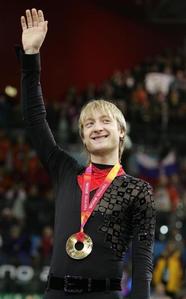 Evgeni Plushenko celebrates her gold medal