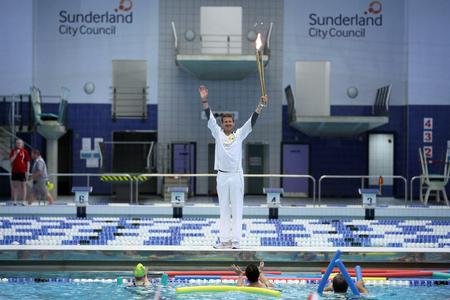 Olympic Torch Takes A Dip