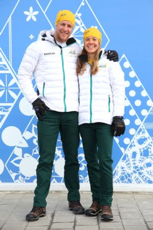 Cross country skiers in opening ceremony outfit
