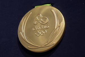 A close-up of the Olympic gold medal