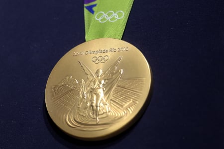 A close-up of the Olympic gold medal