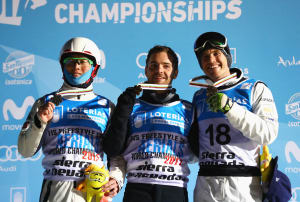 Silver medalist Guangpu Qi of China , gold medalist Jonathon Lillis of the United States and bronze medalist David Morris of Australia during the medal ceremony for the Men's Aerials Final at the FIS Freestyle Ski and Snowboard World Championships