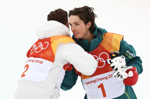 Scotty James congratulates Shaun White after the men's snowboard halfpipe finals