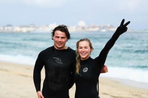Harry Laidlaw and Danielle Scott in the cold waters of Yeongjin-gil Beach